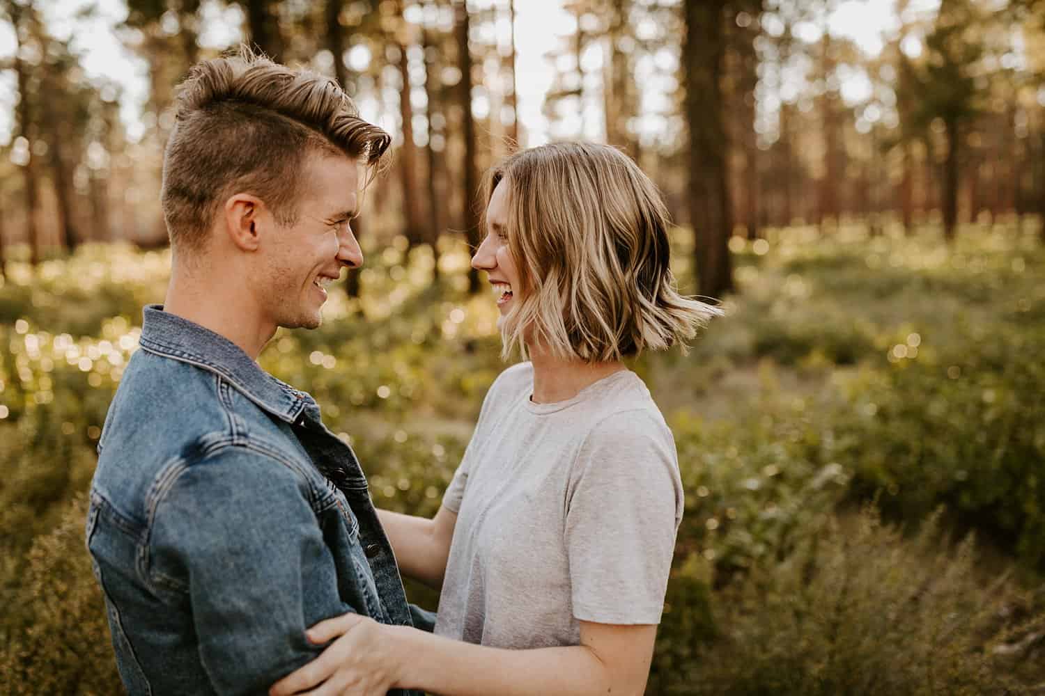 Engaged couple in high desert forest in Central Oregon