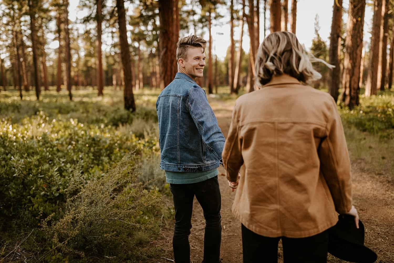 Engaged couple in high desert forest in Central Oregon