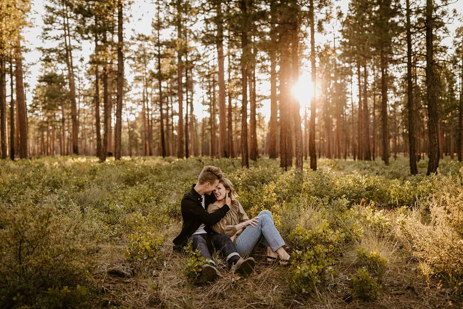 Engaged couple in high desert forest in Central Oregon